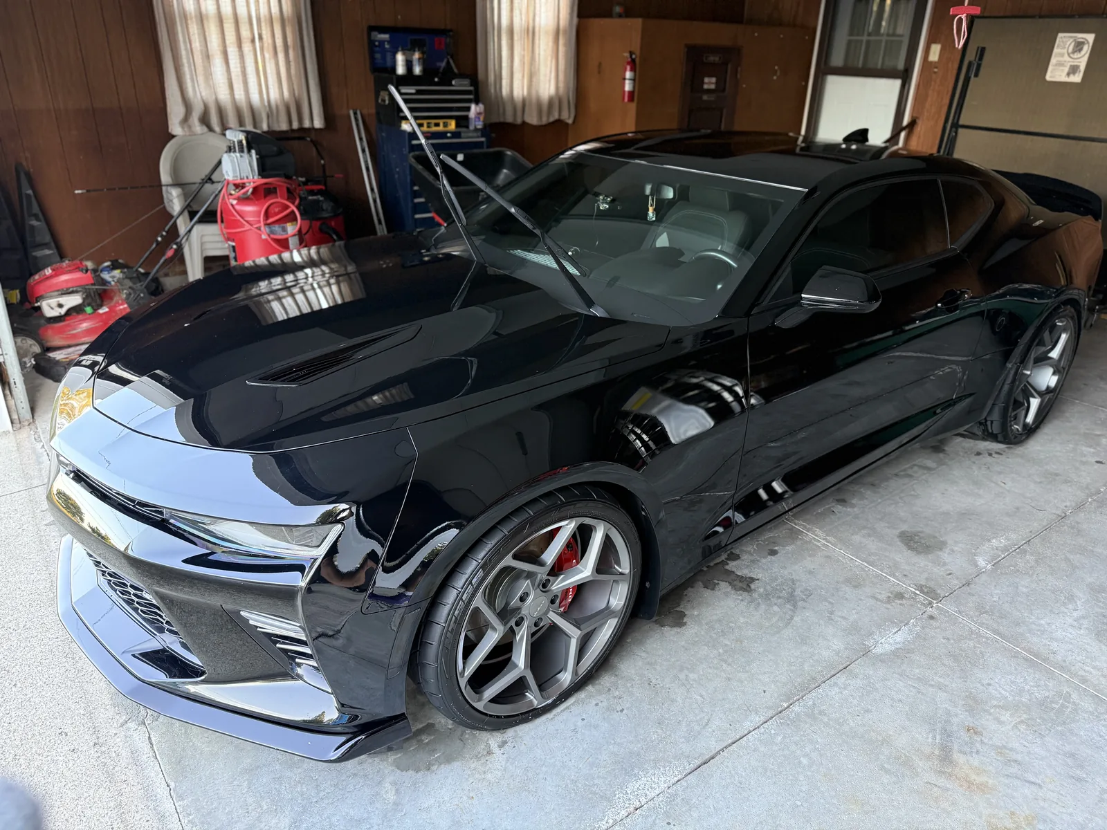 A black Chevrolet Camaro with a deep, mirror-gloss finish detailed by Wax N' Go