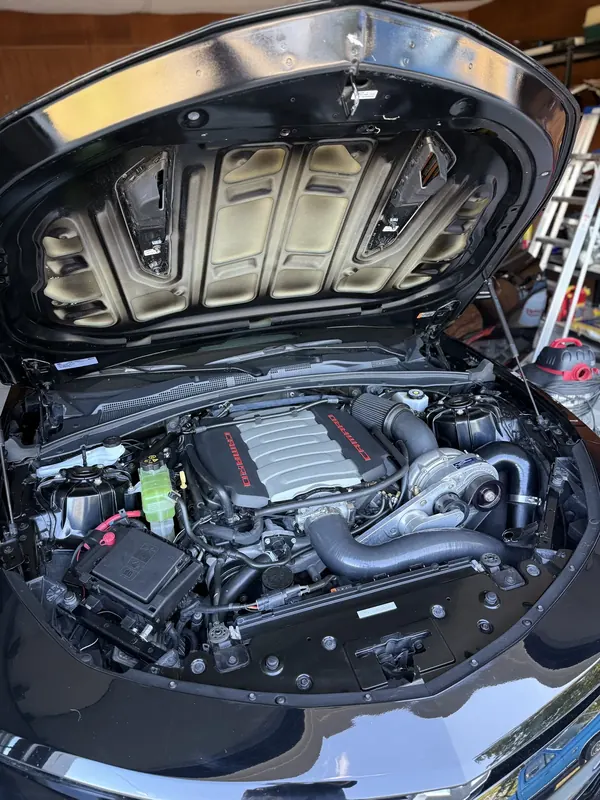 A degreased and dressed engine bay cleaned by Wax N' Go